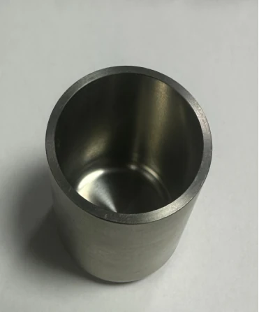 Machined molybdenum crucible with cylindrical thick-wall body and smooth inner surface